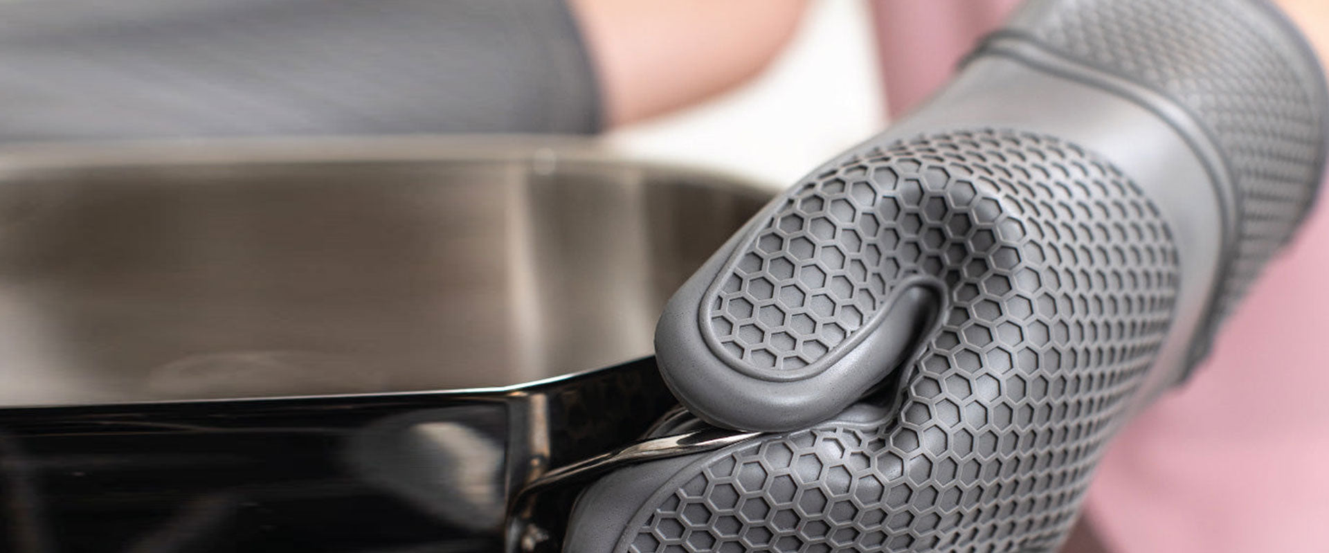 Strong heat resistant oven mitts from Gorilla Grip shown in textured silicone in gray color