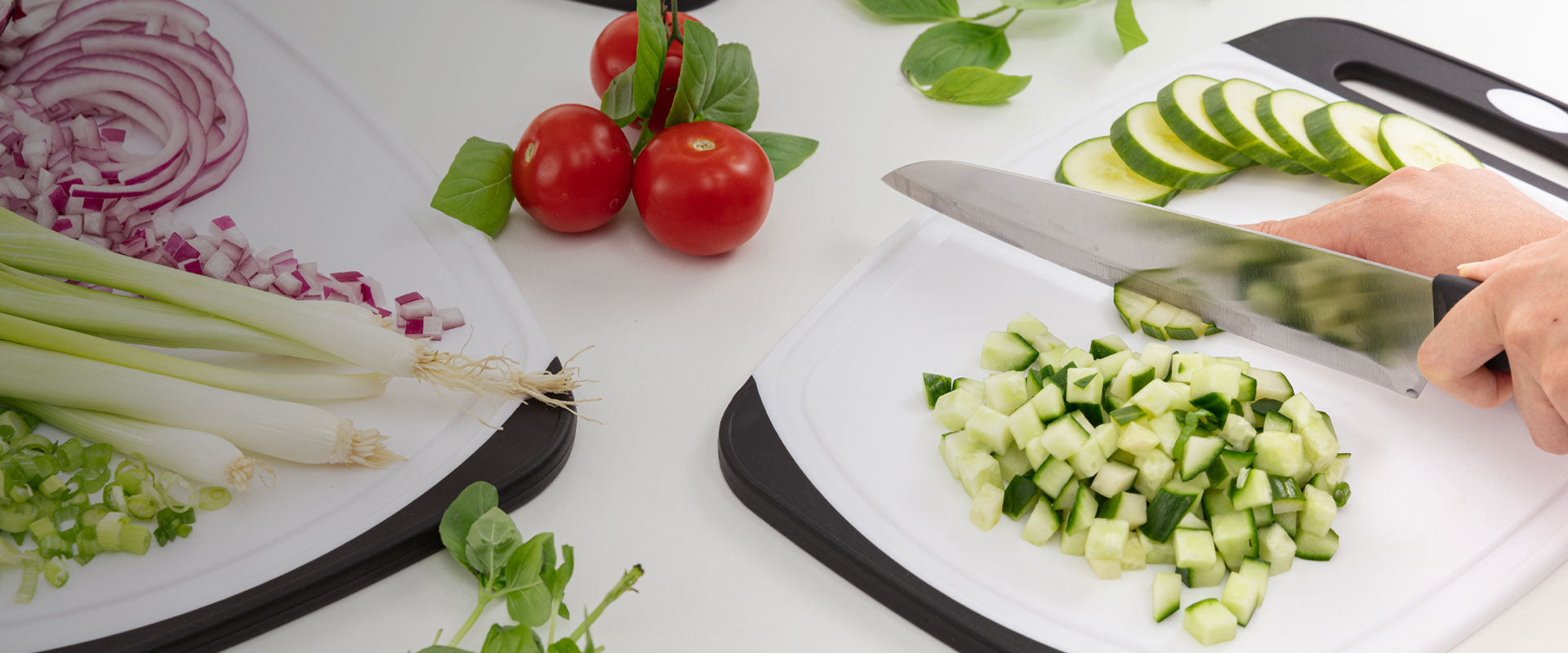 Gorilla Grip cutting boards displayed with chopped produce. 