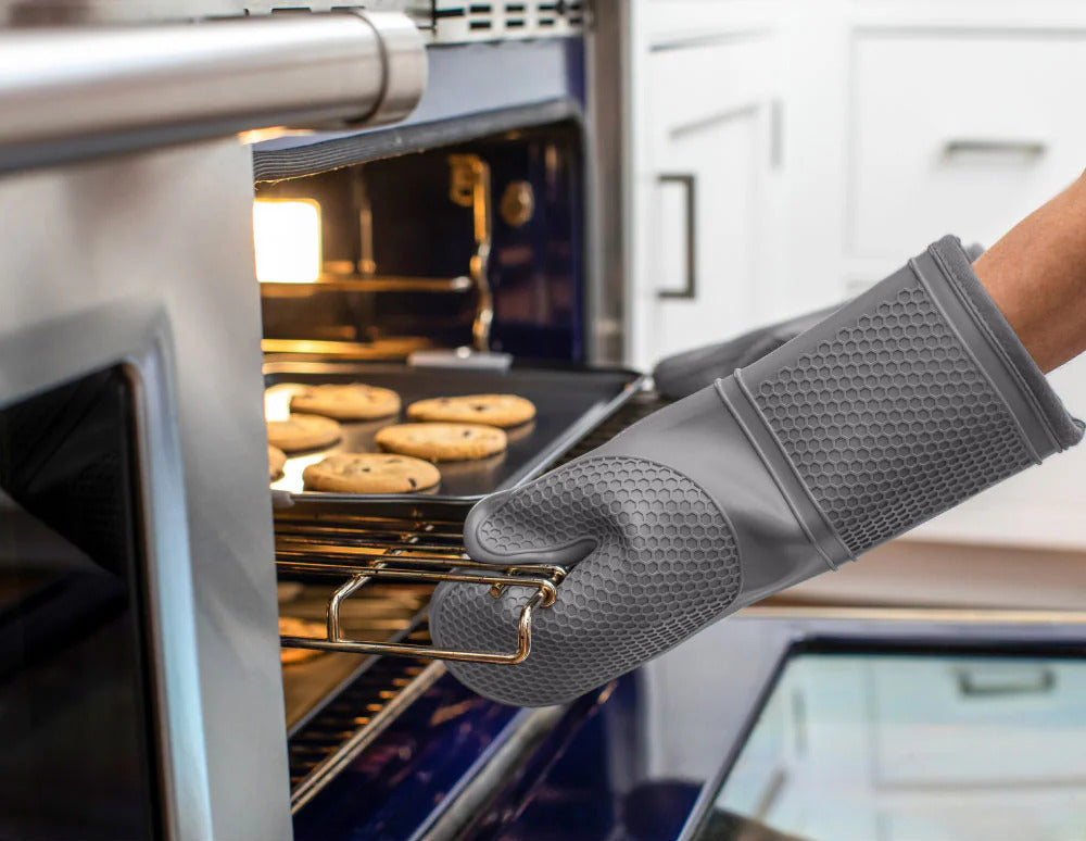 Person wearing Gorilla Grip Oven Mitts pulling cookies from the oven