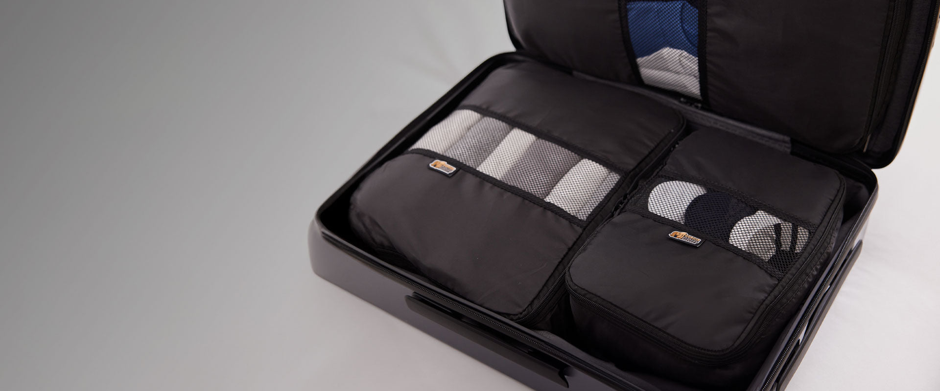 Open suitcase showing Gorilla Grip packing cubes for organized travel
